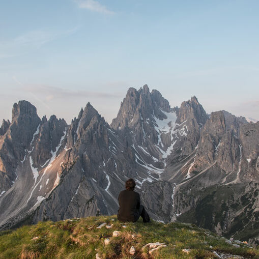 picture of a man looking at the mountains